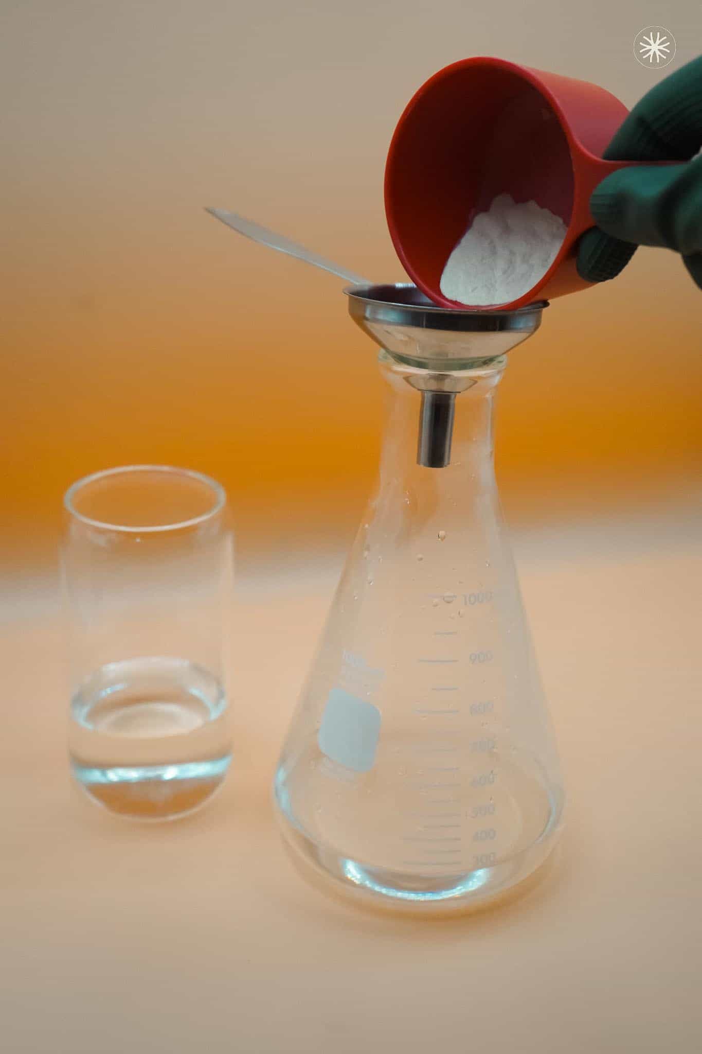 Pouring MEA powder in flask