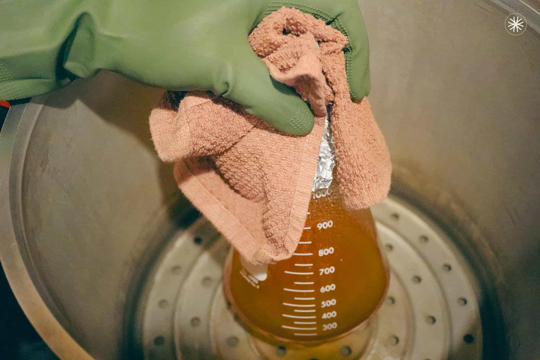 Removing flask with towel
